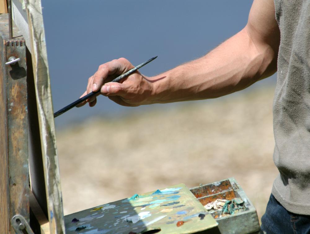bigstock-Artist-s-hand-with-a-brush-pai-25930931