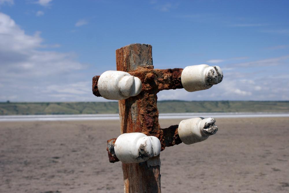 bigstock-Buried-Old-Wooden-Electricity--29264729