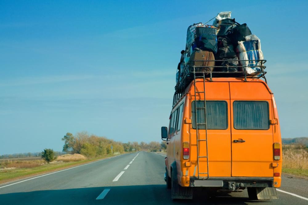 bigstock-The-small-bus-with-bags-on-a-r-18872150